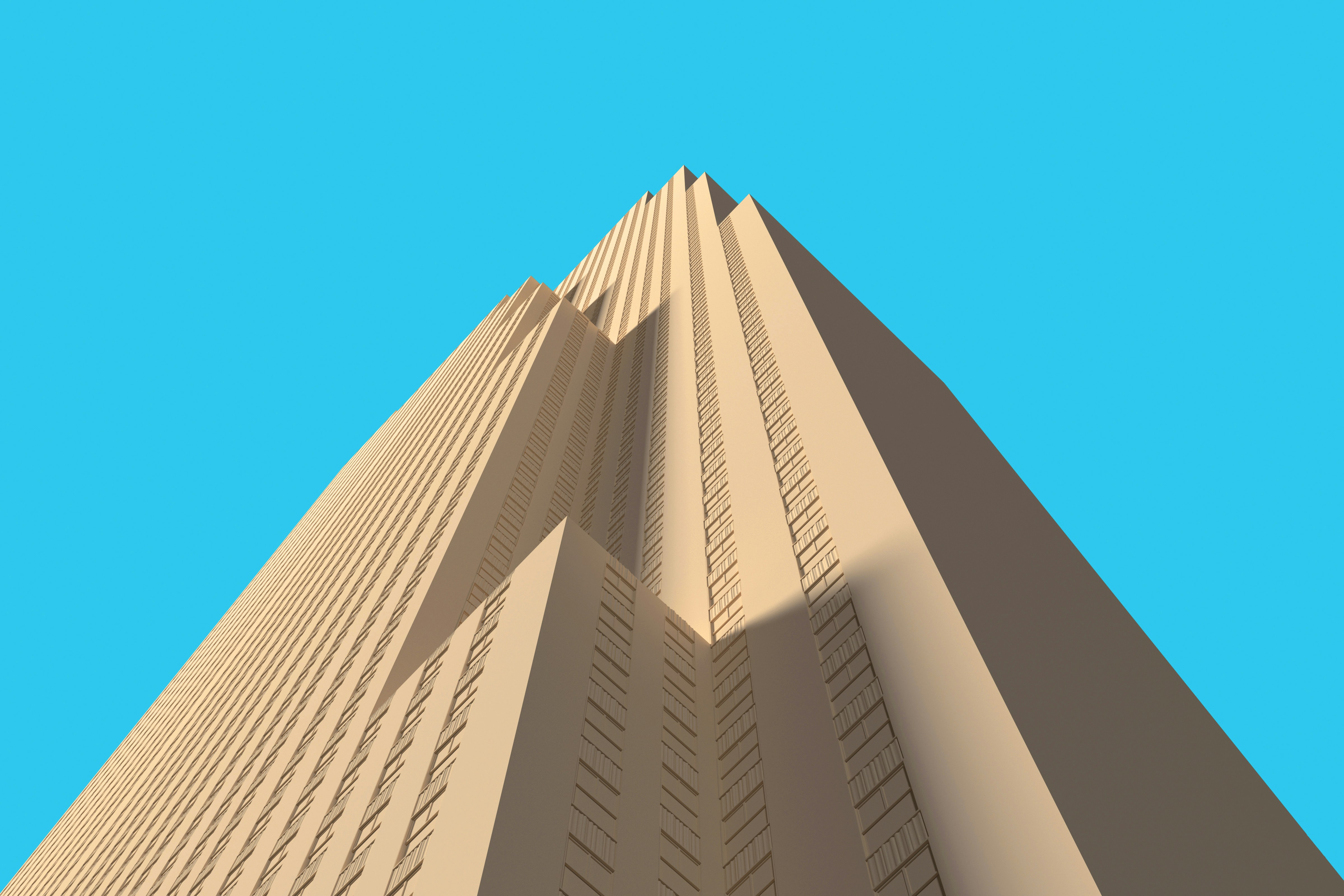 um edifício muito alto com um céu azul no fundo