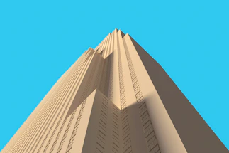 a very tall building with a blue sky in the background