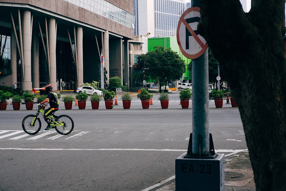 a person riding a bike on a city street