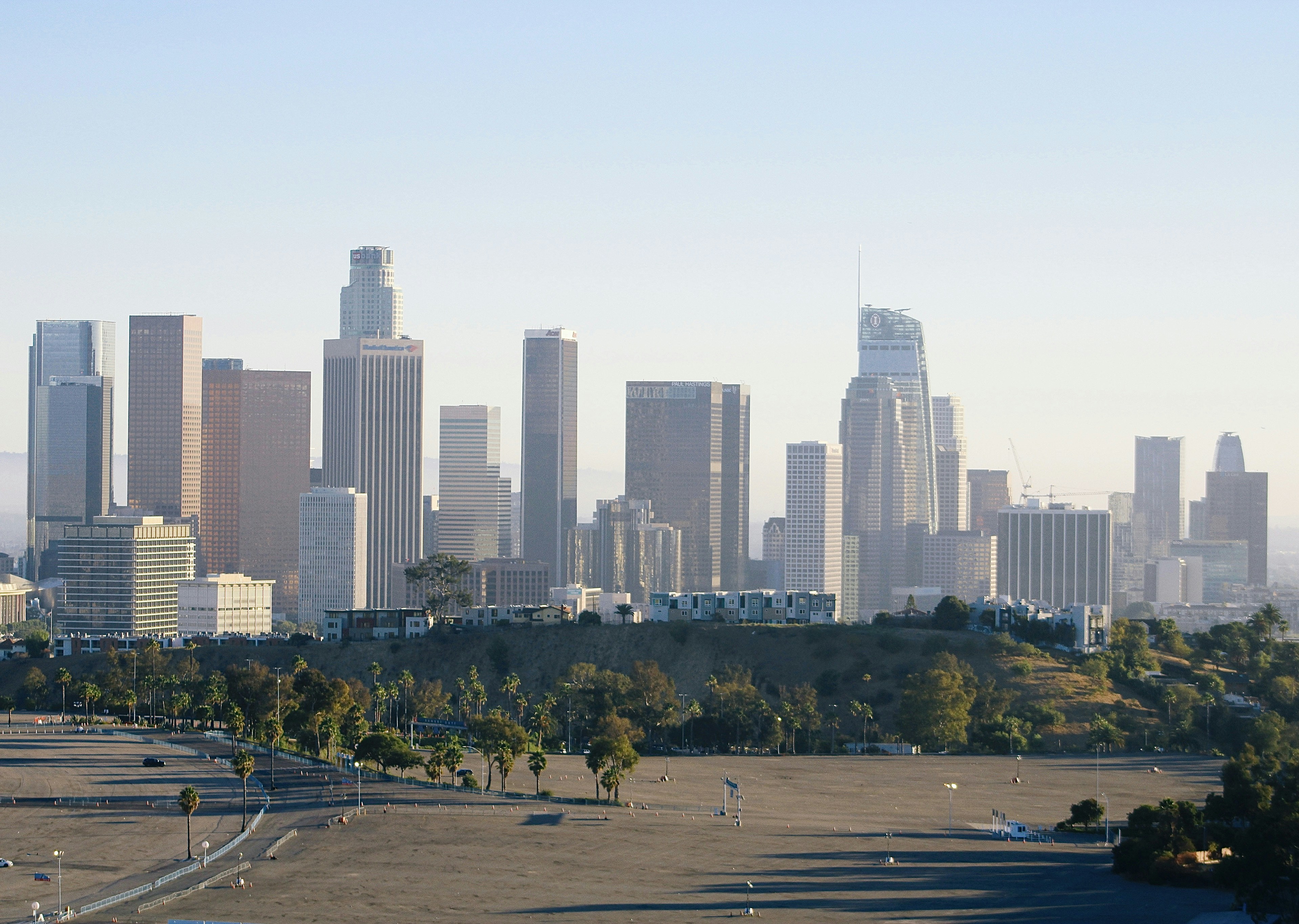 a view of a city with tall buildings in the background