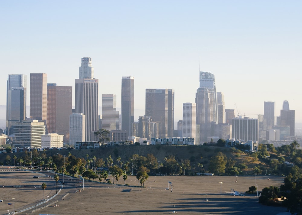 a view of a city with tall buildings in the background