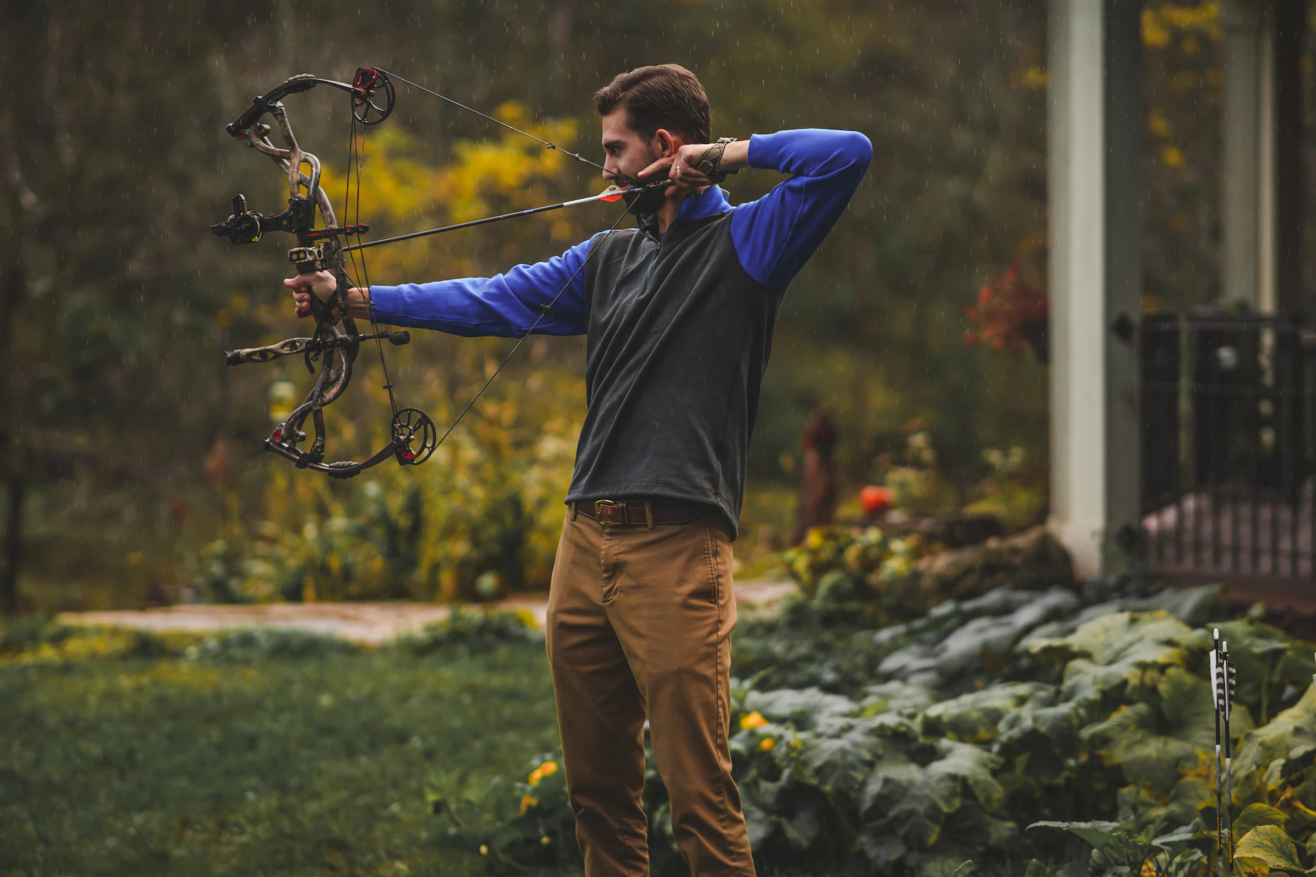 Traditional archer drawing a recurve bow