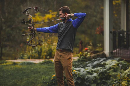 Bowhunter drawing a compound bow