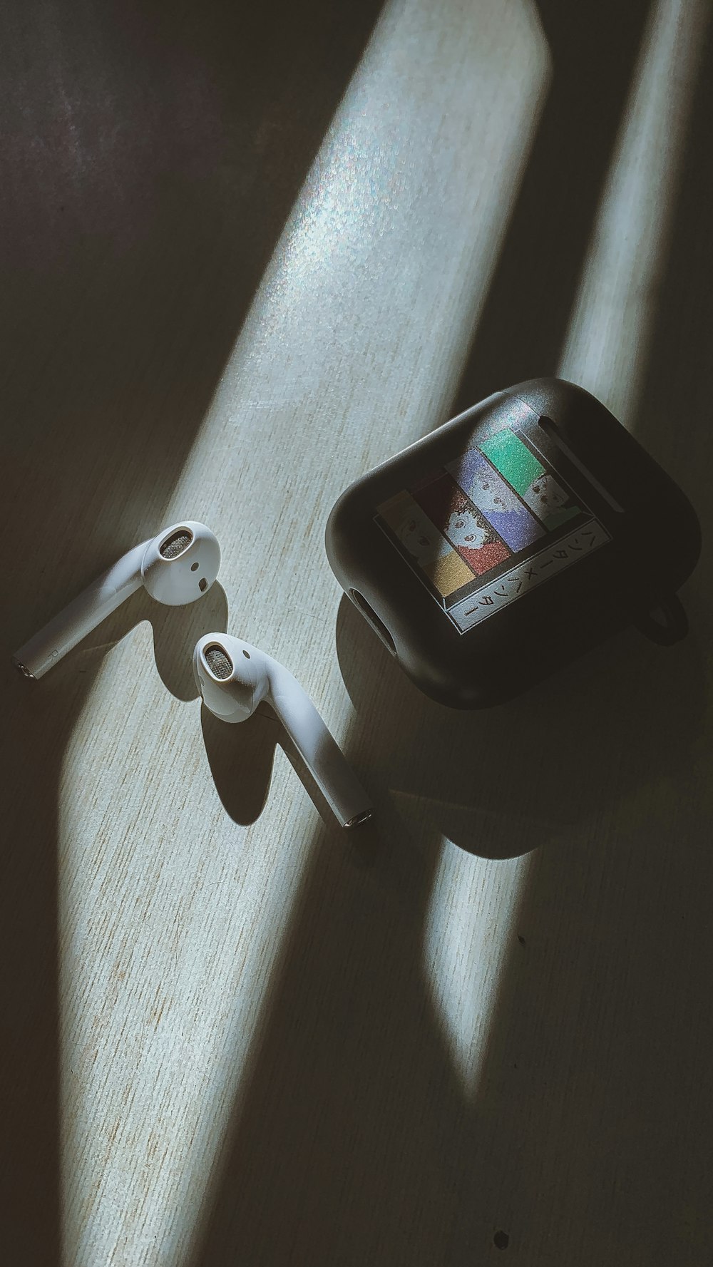 a smart phone sitting on top of a wooden table