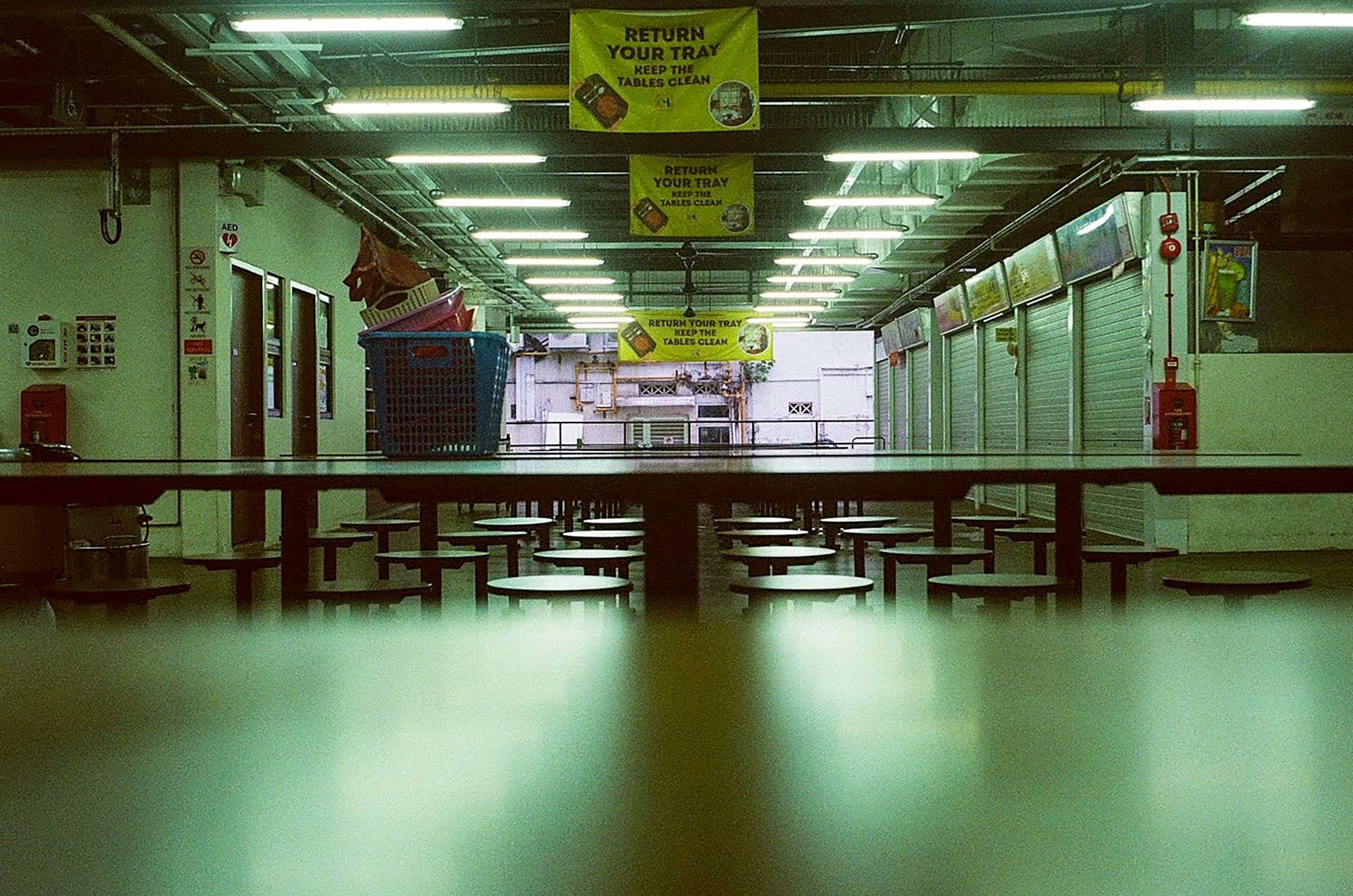 a table and chairs in a room with lights