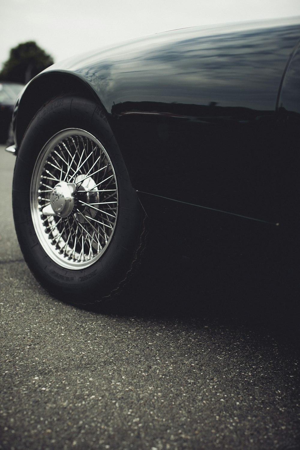 a black sports car parked on the side of the road