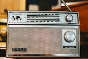 an old radio sitting on top of a table
