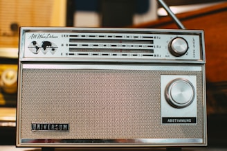 an old radio sitting on top of a table