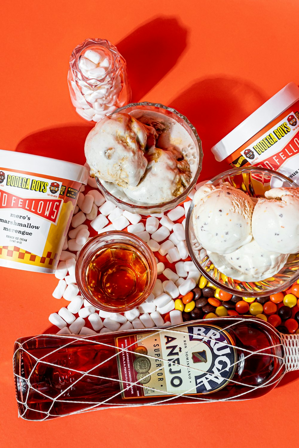 a table topped with ice cream and candy