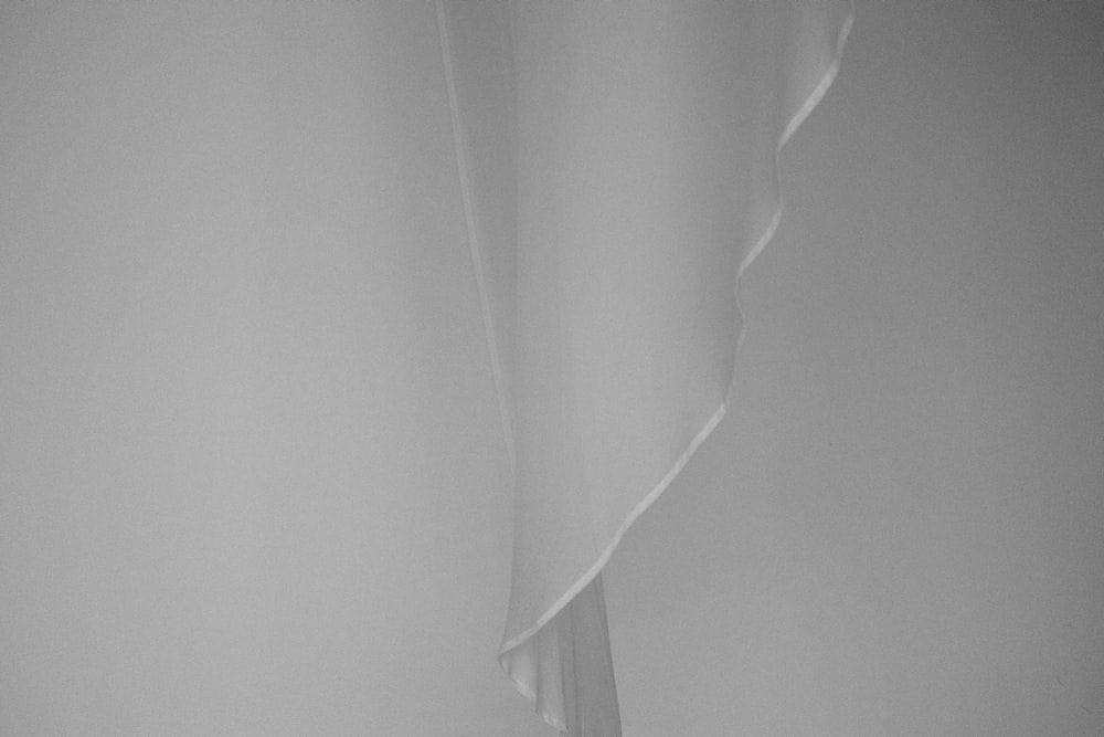 a black and white photo of a curtain