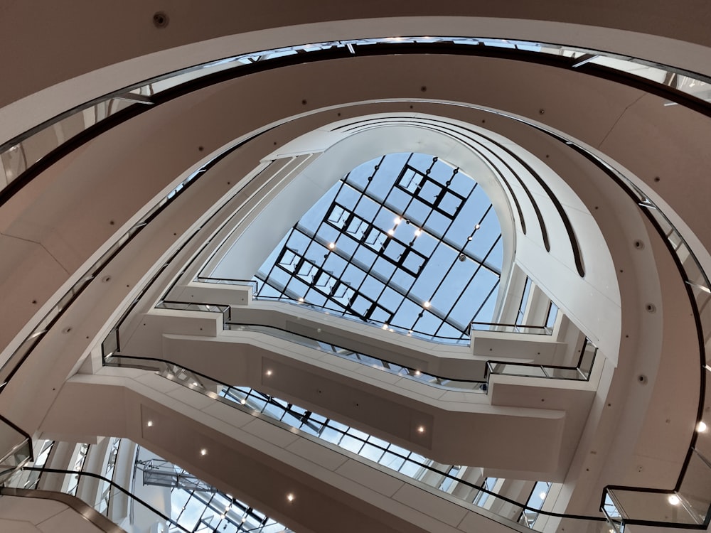 the ceiling of a large building with a lot of windows