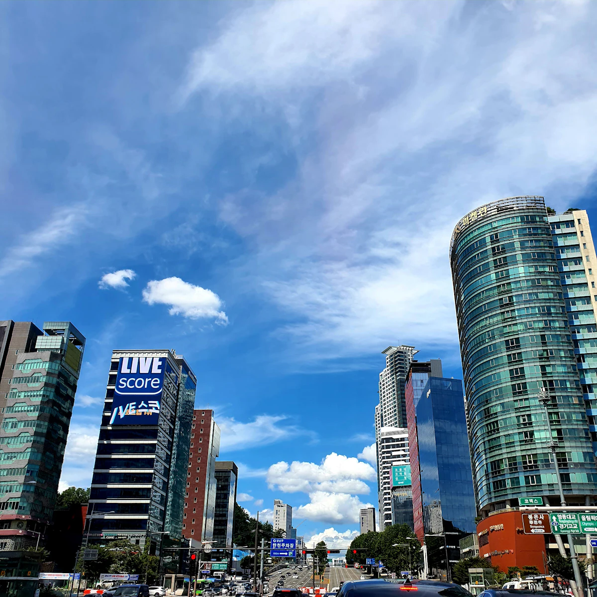 Tall office buildings lining a Gangnam street in Seoul
