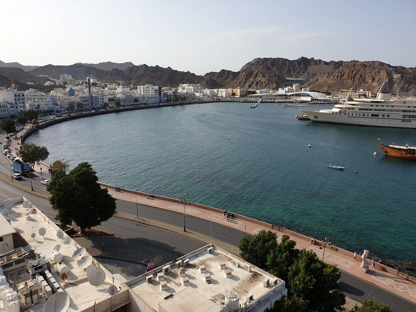 Muttrah harbour, corniche and mountains in clear daylight