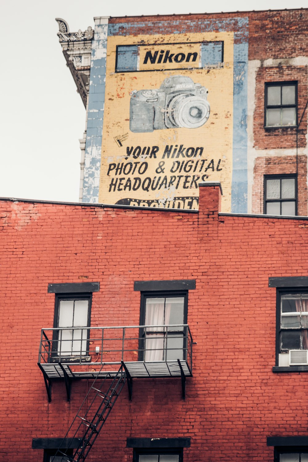 a red brick building with a sign on top of it