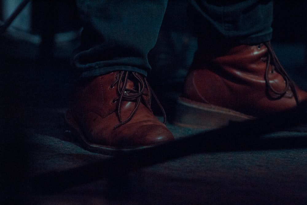 a close up of a person wearing red shoes