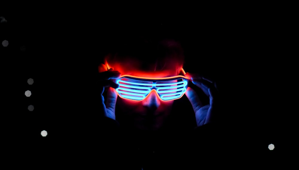 a person wearing a pair of glowing glasses