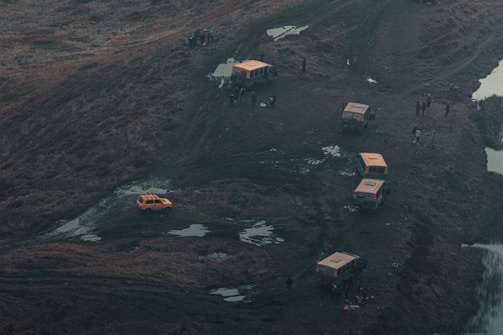 a group of people standing on top of a hill