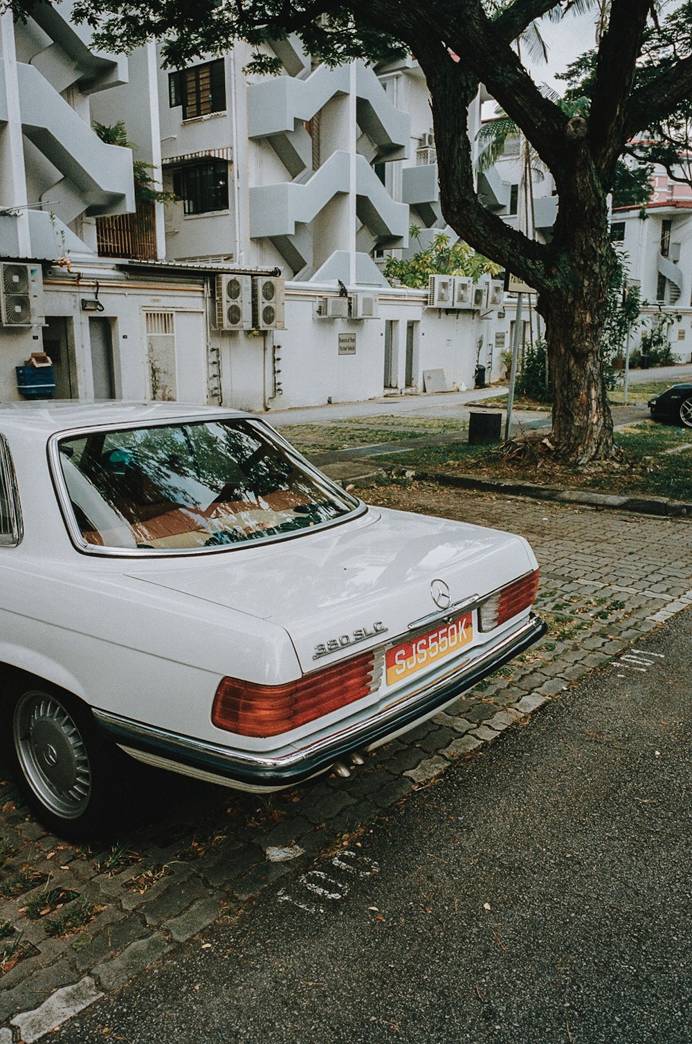 a white car parked on the side of the road