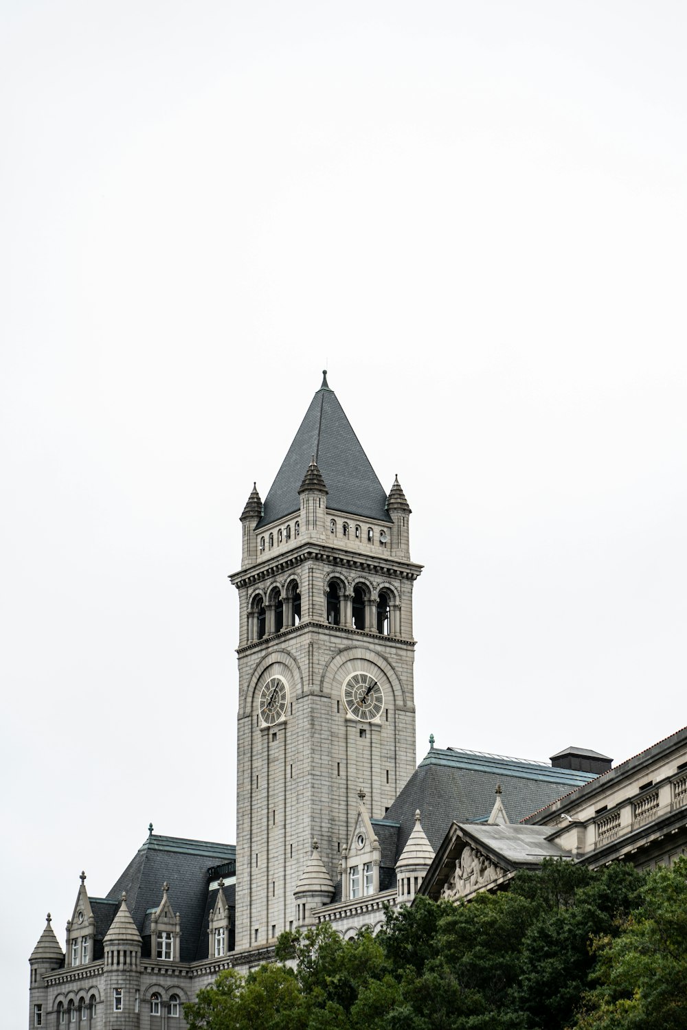 a very tall building with a clock on it's side