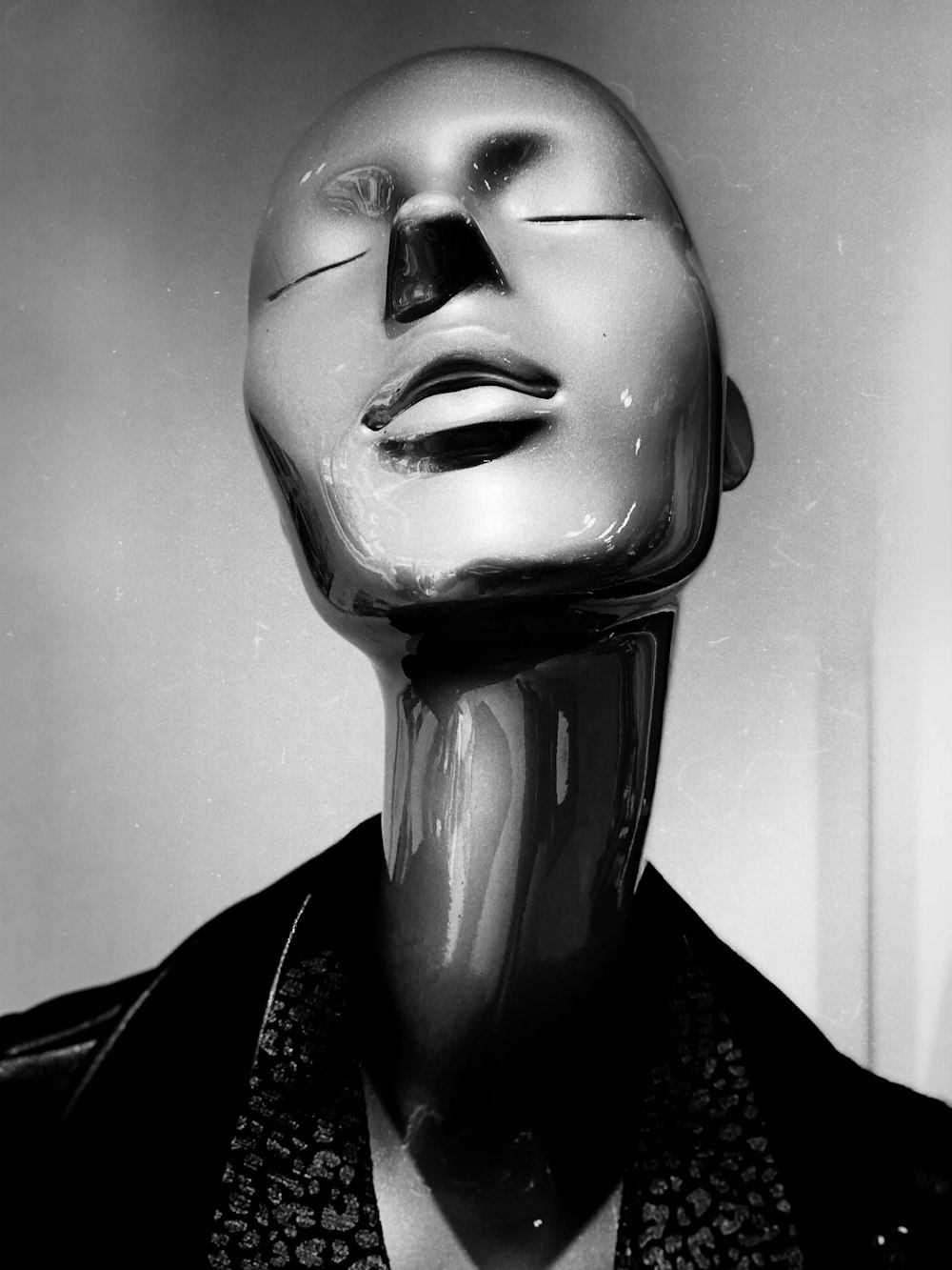 a black and white photo of a mannequin's head