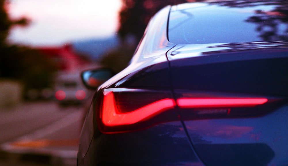 the tail lights of a car on a city street