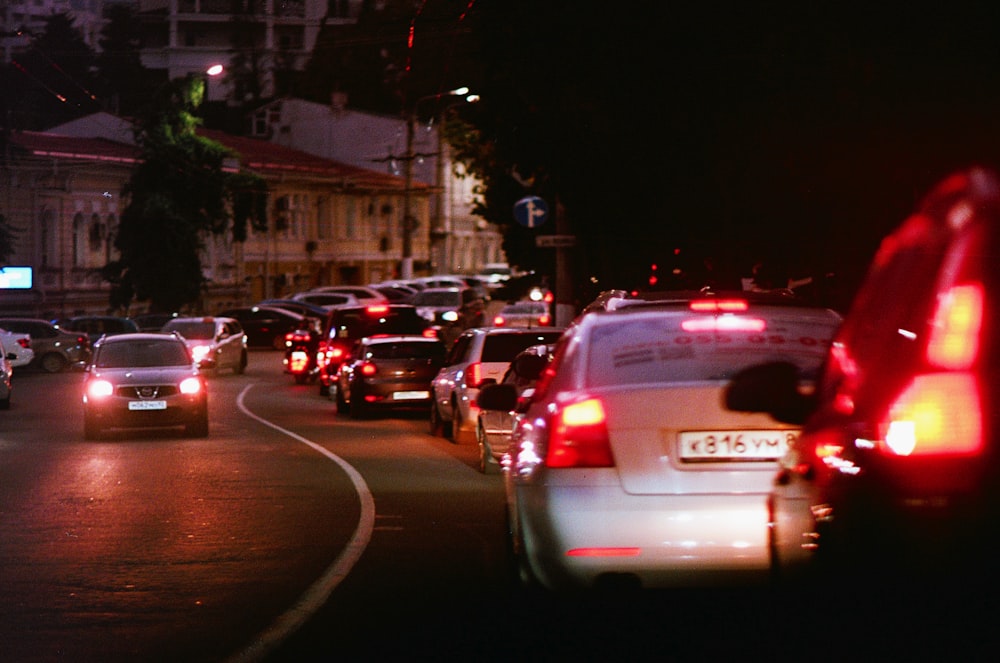 a street filled with lots of traffic at night