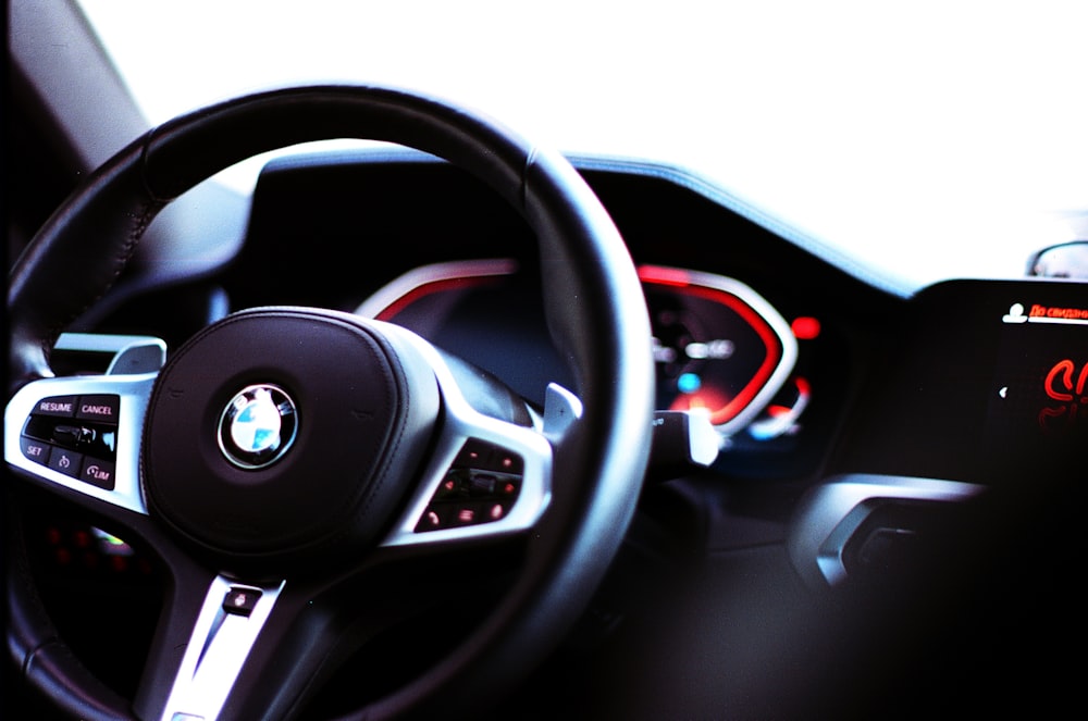 a close up of a steering wheel and dashboard of a car