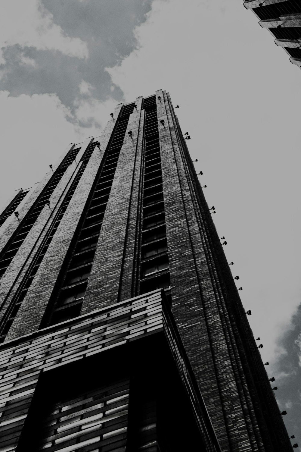 a black and white photo of a tall building