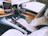 Interior view of a car dashboard featuring a large Android screen with colorful app icons.