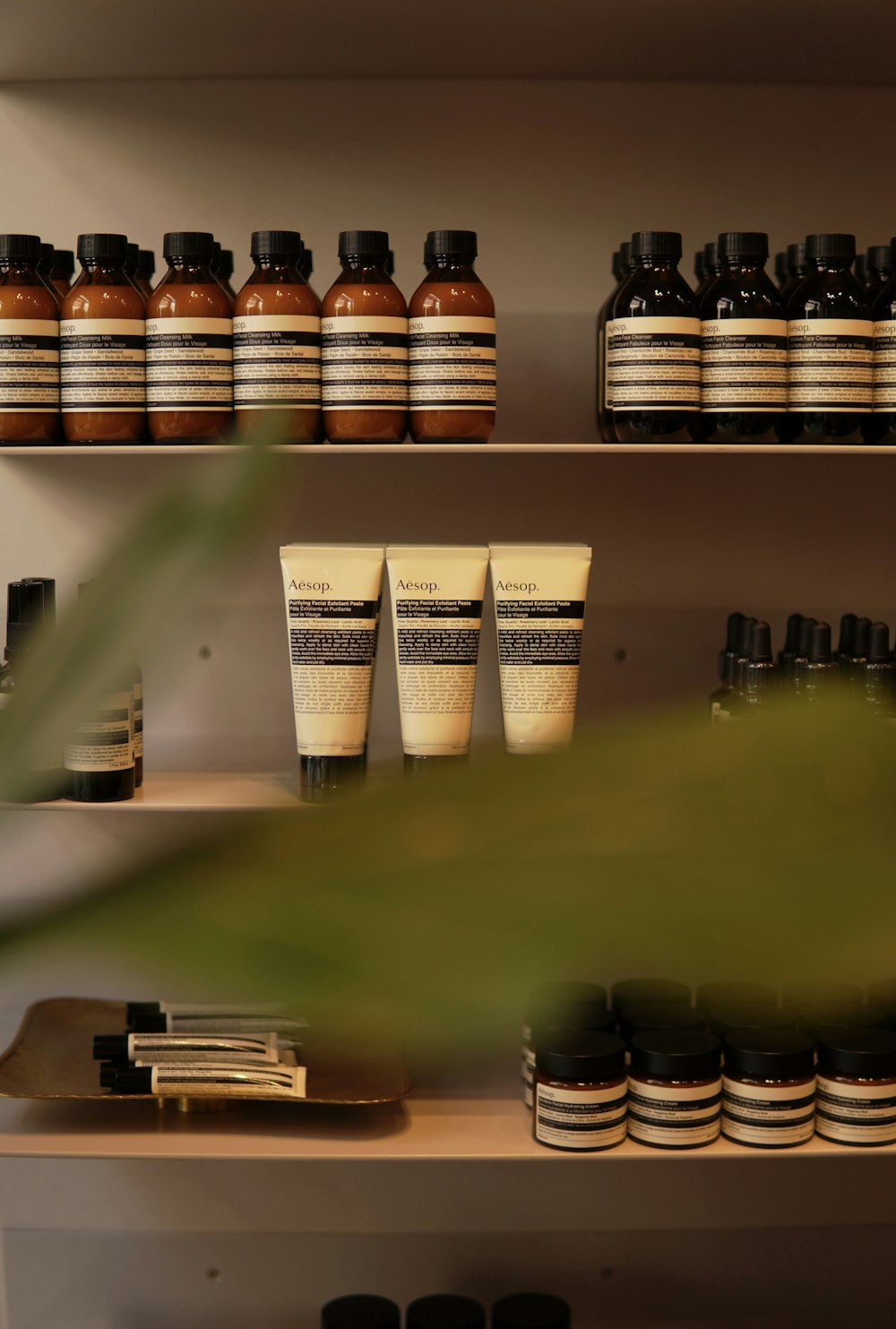 a shelf filled with lots of different types of bottles