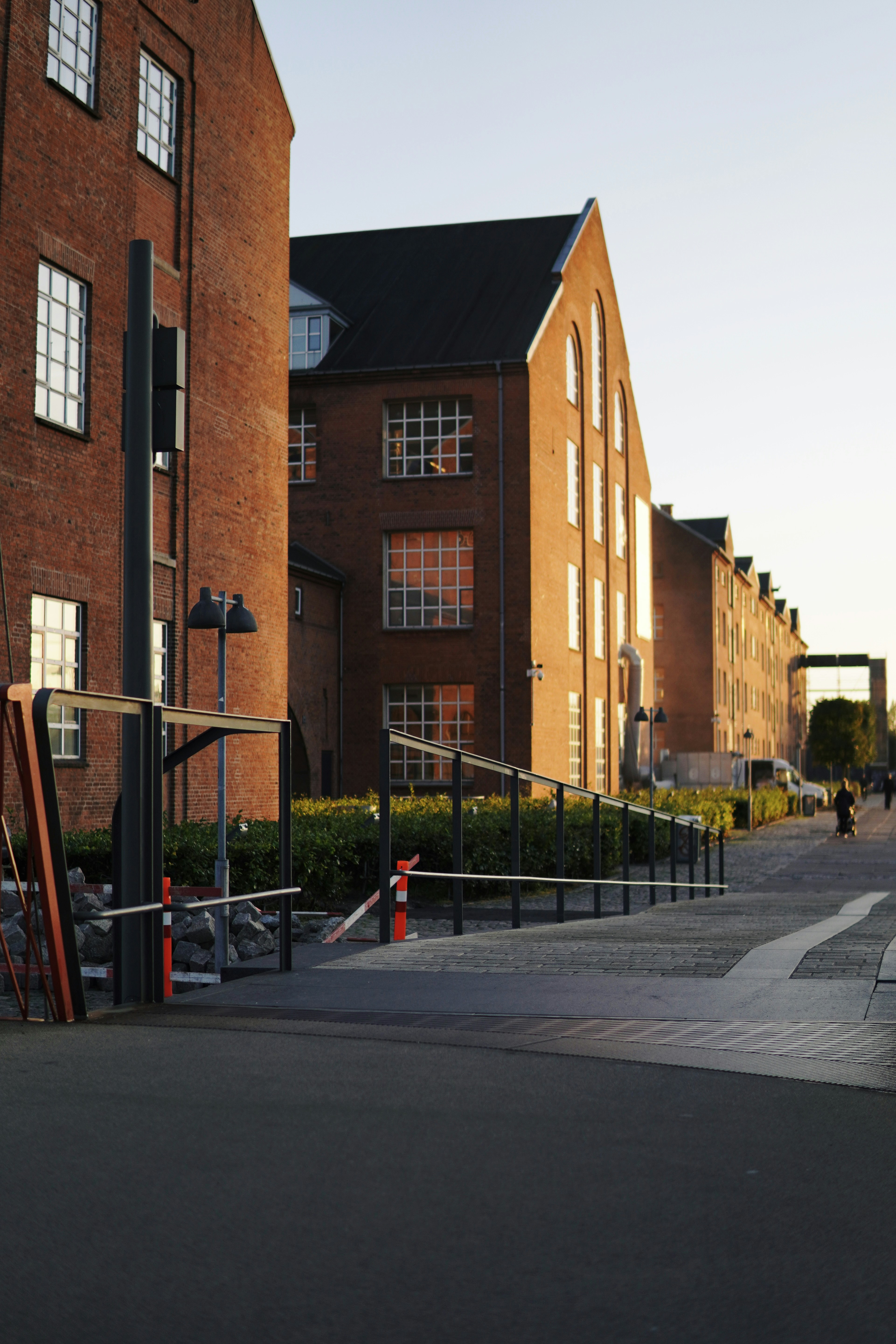 a large brick building with a playground in front of it