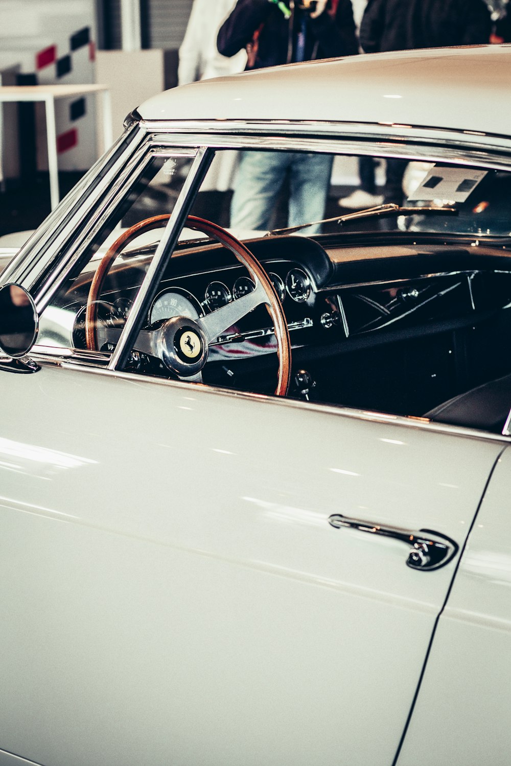 a white car with a steering wheel and dashboard