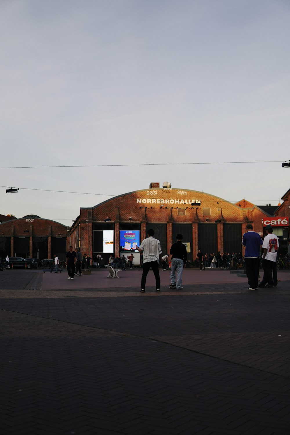 a group of people standing outside of a building