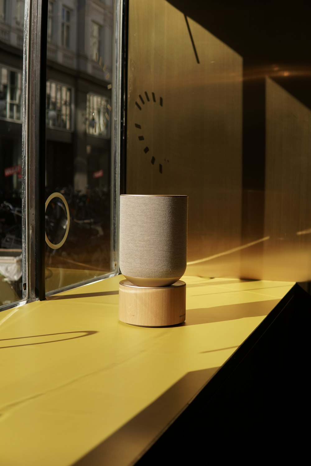 a cup sitting on top of a yellow counter