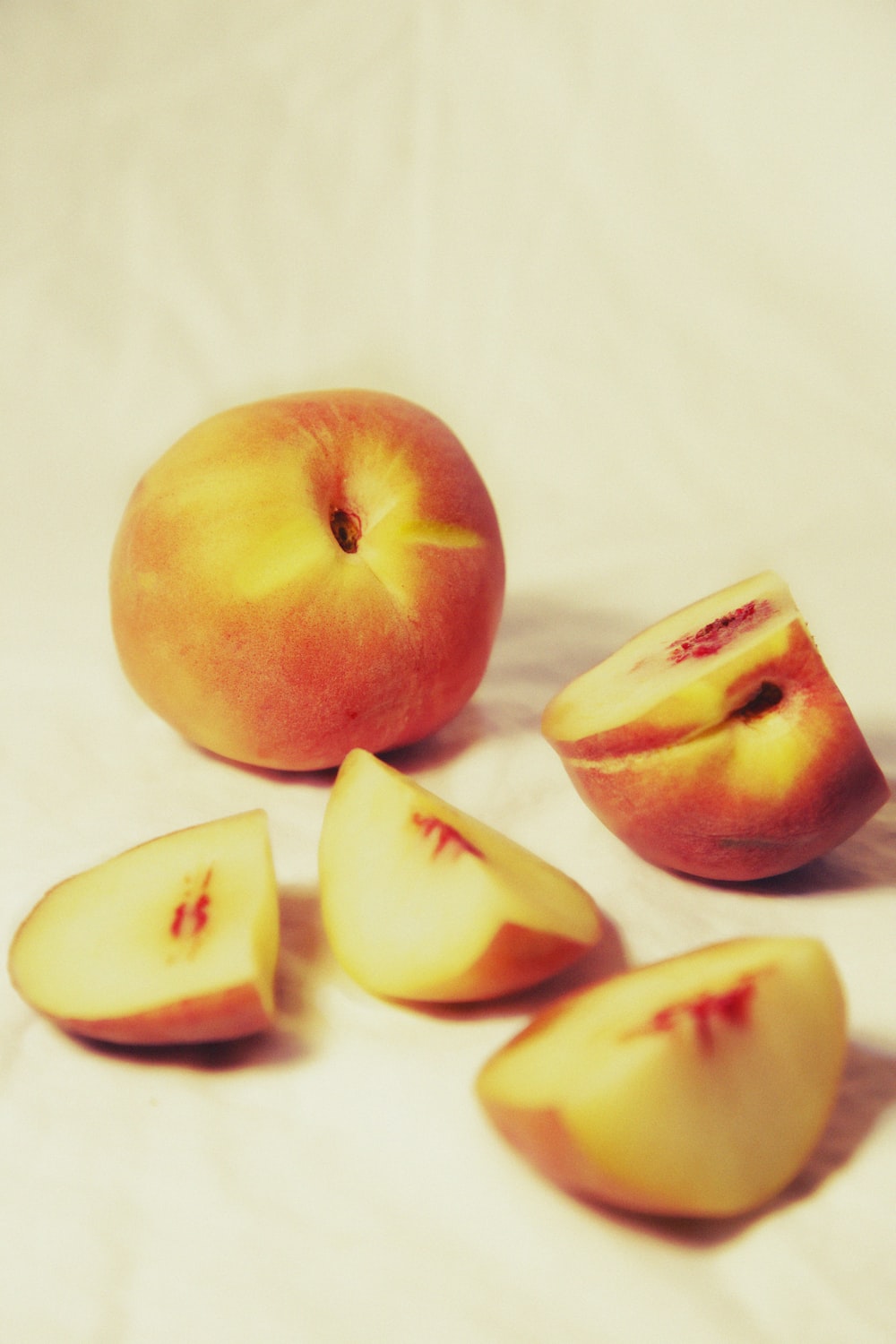 a group of pieces of fruit sitting on top of a table