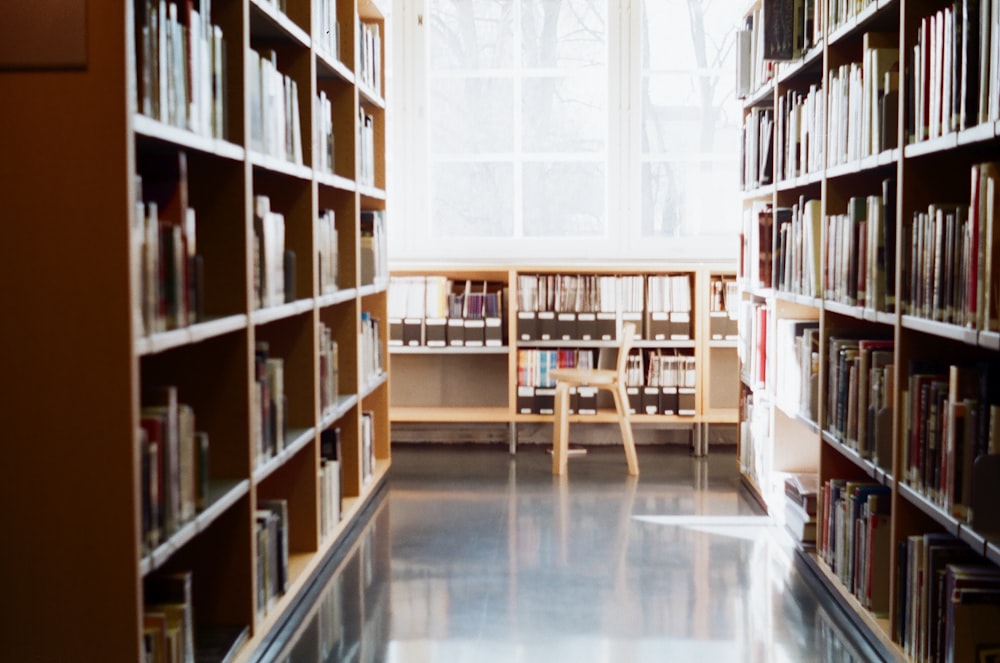 a long row of bookshelves in a library