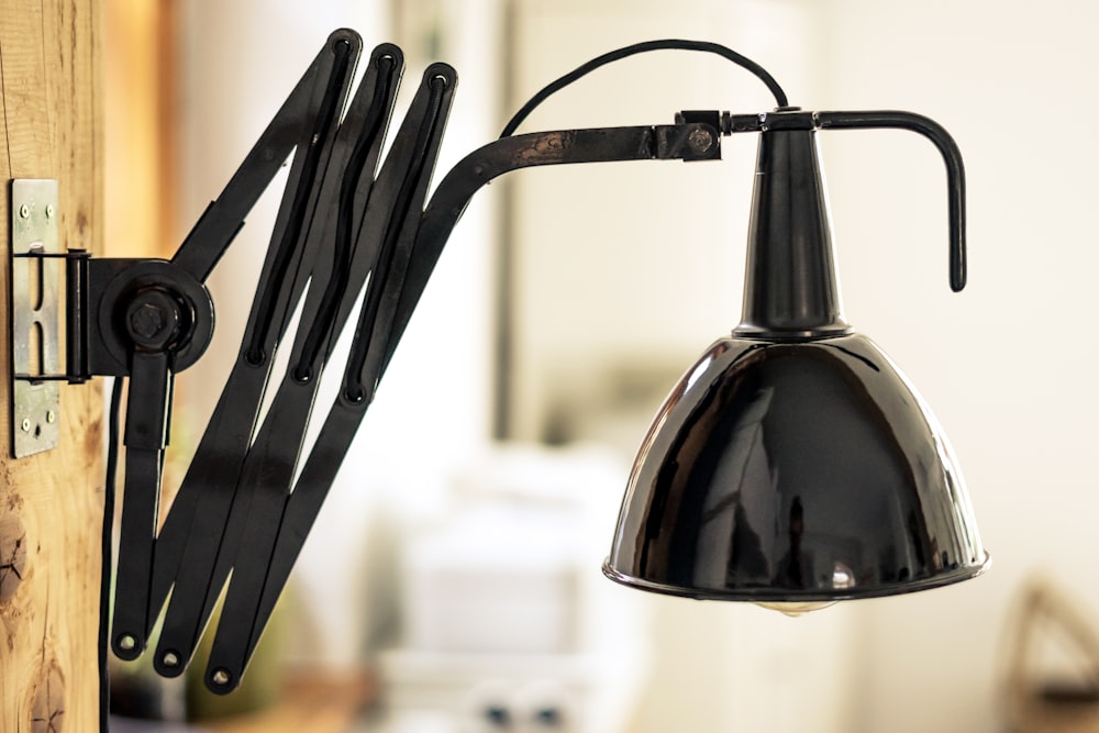 a black light hanging from a wall next to a mirror