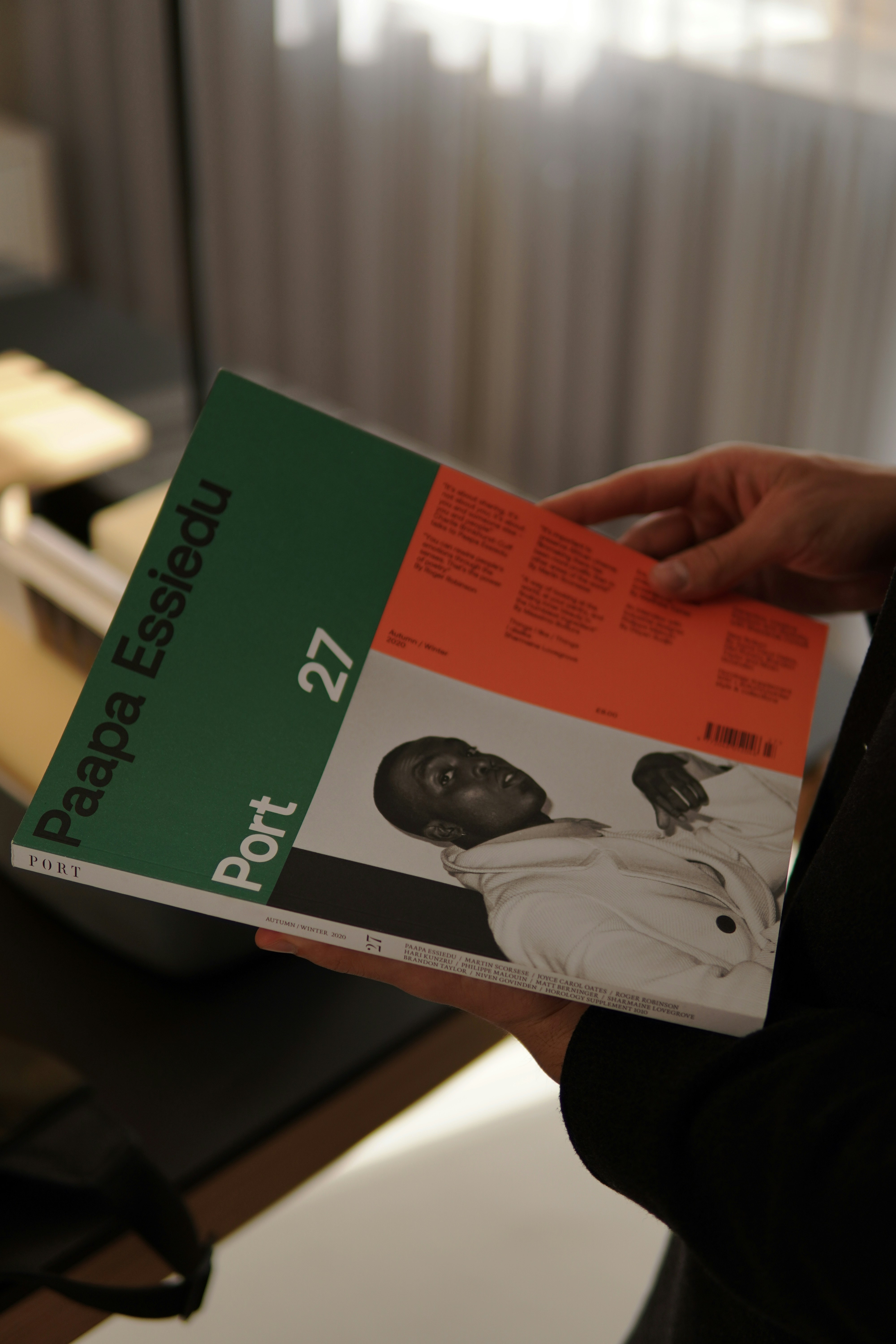 a person holding a book in their hand