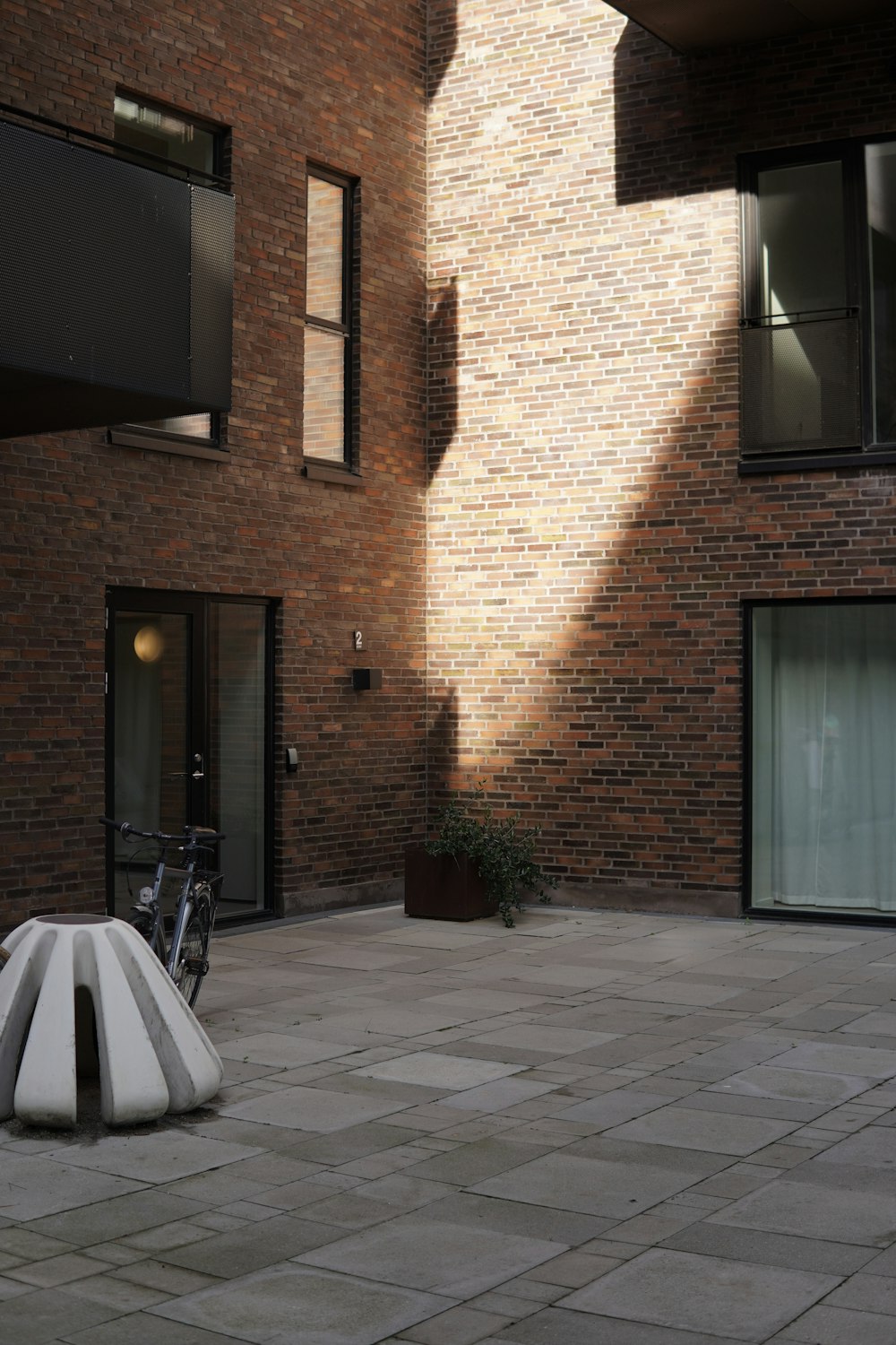 a bench sitting in the middle of a courtyard