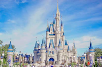 a large castle with a lot of people around it