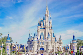 a large castle with a lot of people around it