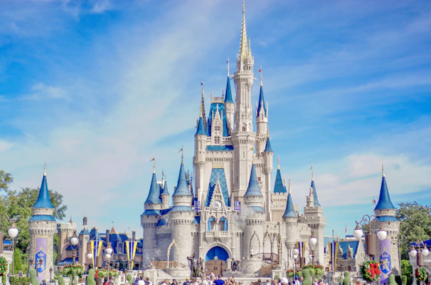 a large castle with a lot of people around it