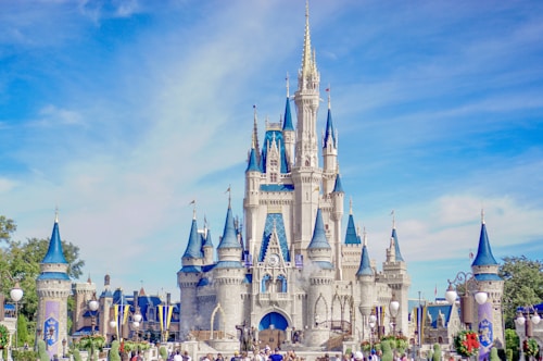 a large castle with a lot of people around it