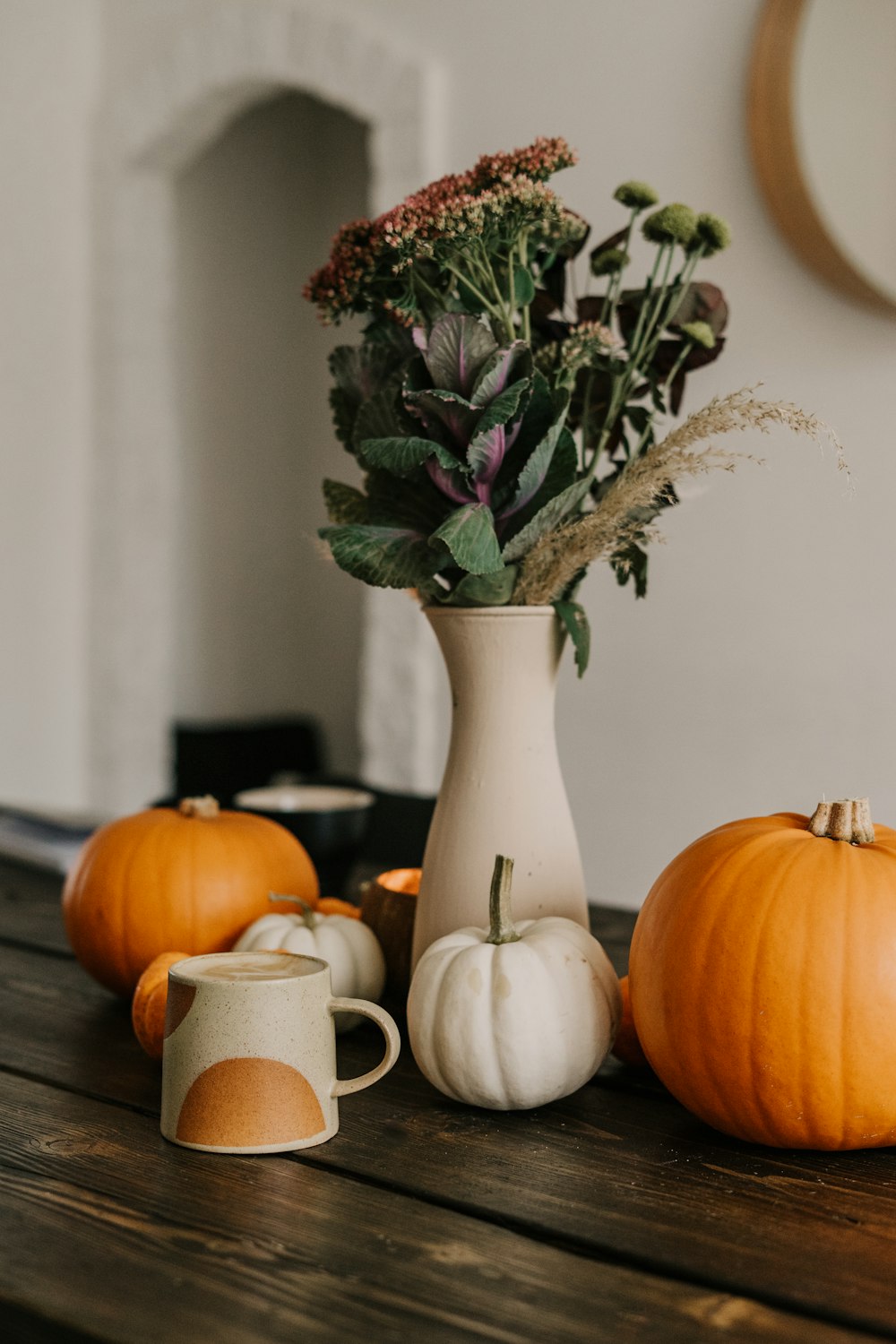 a wooden table topped with a vase filled with flowers