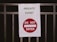 A sign is attached to a metal railing. The sign reads 'PRIVATE EVENT' in green text and features a red circle with a white horizontal bar accompanied by the words 'DO NOT ENTER' in white.