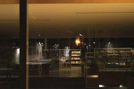 Photo of a professional law office interior with warm lighting and legal books on shelves.