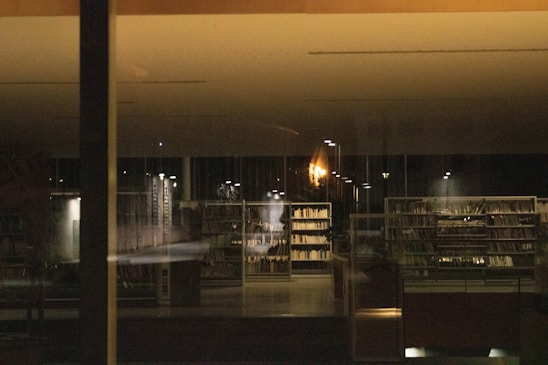 Photo of a professional law office interior with warm lighting and legal books on shelves.