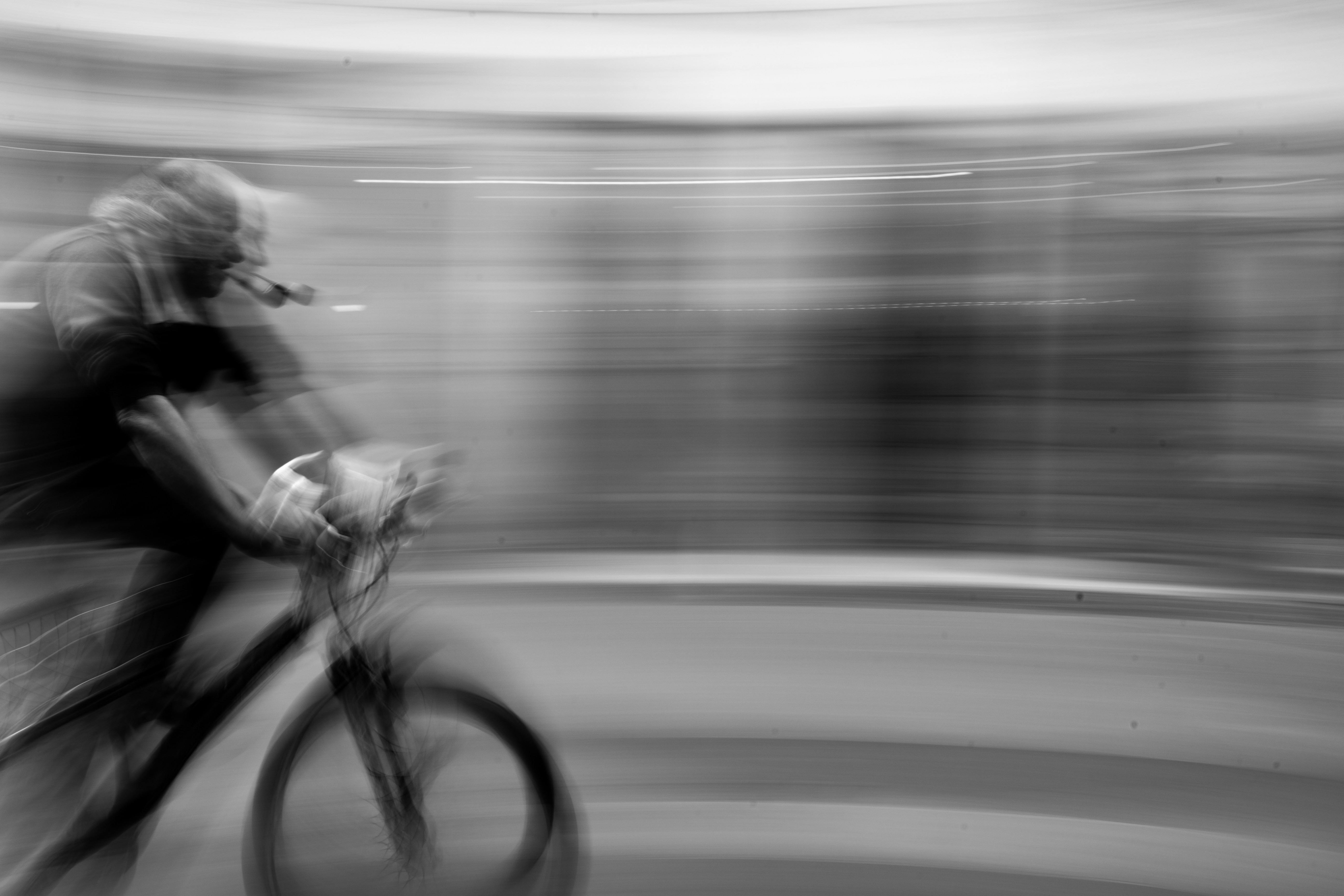 a blurry photo of a person riding a bike