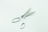 a pair of scissors sitting on top of a table
