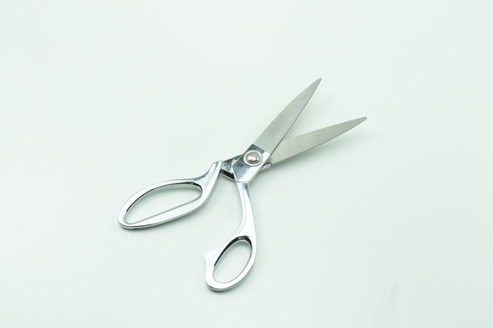 a pair of scissors sitting on top of a table